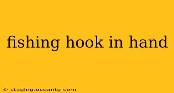 fishing hook in hand