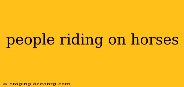 people riding on horses