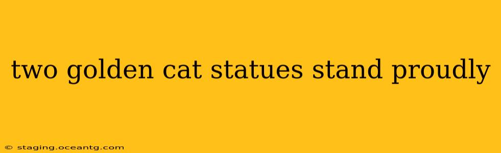 two golden cat statues stand proudly